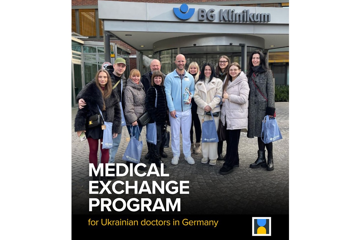 A group of eleven Ukrainian and German doctors in front of the G Klinikum in Germany while attending an exchange medical program.
